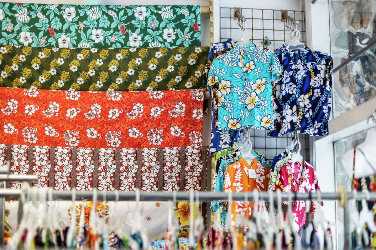 Floral shirts and fabrics hang from the walls of Polynesian Island Luau on the northern edge of Daly City, Calif., on Friday, Nov. 11, 2022.