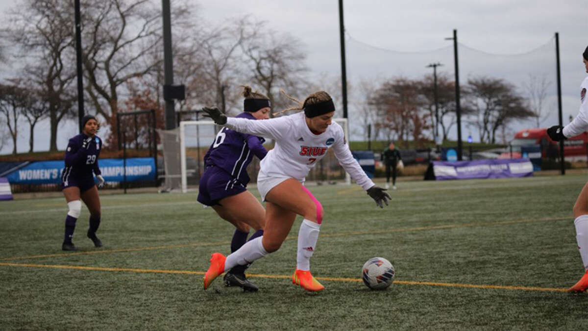 SIUE's Lily Schneiders dribbles against Northwestern on Saturday. The Cougars were eliminated from the NCAA Tournament with the 3-0 loss. 