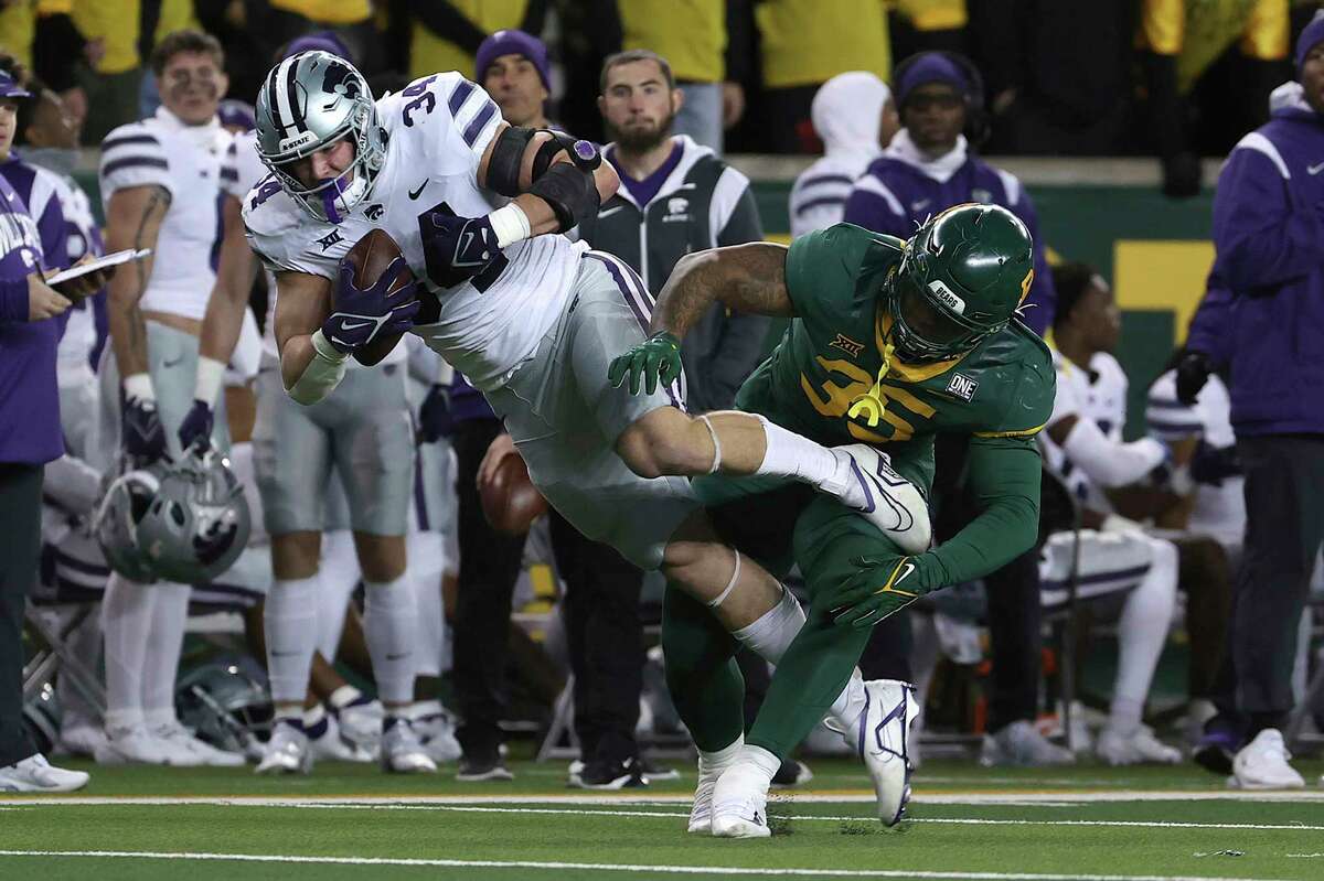 Kansas State tight end Ben Sinnott catches a pass over Baylor linebacker Jackie Marshall in the first half of an NCAA college football game, Saturday, Nov. 12, 2022, in Waco, Texas.