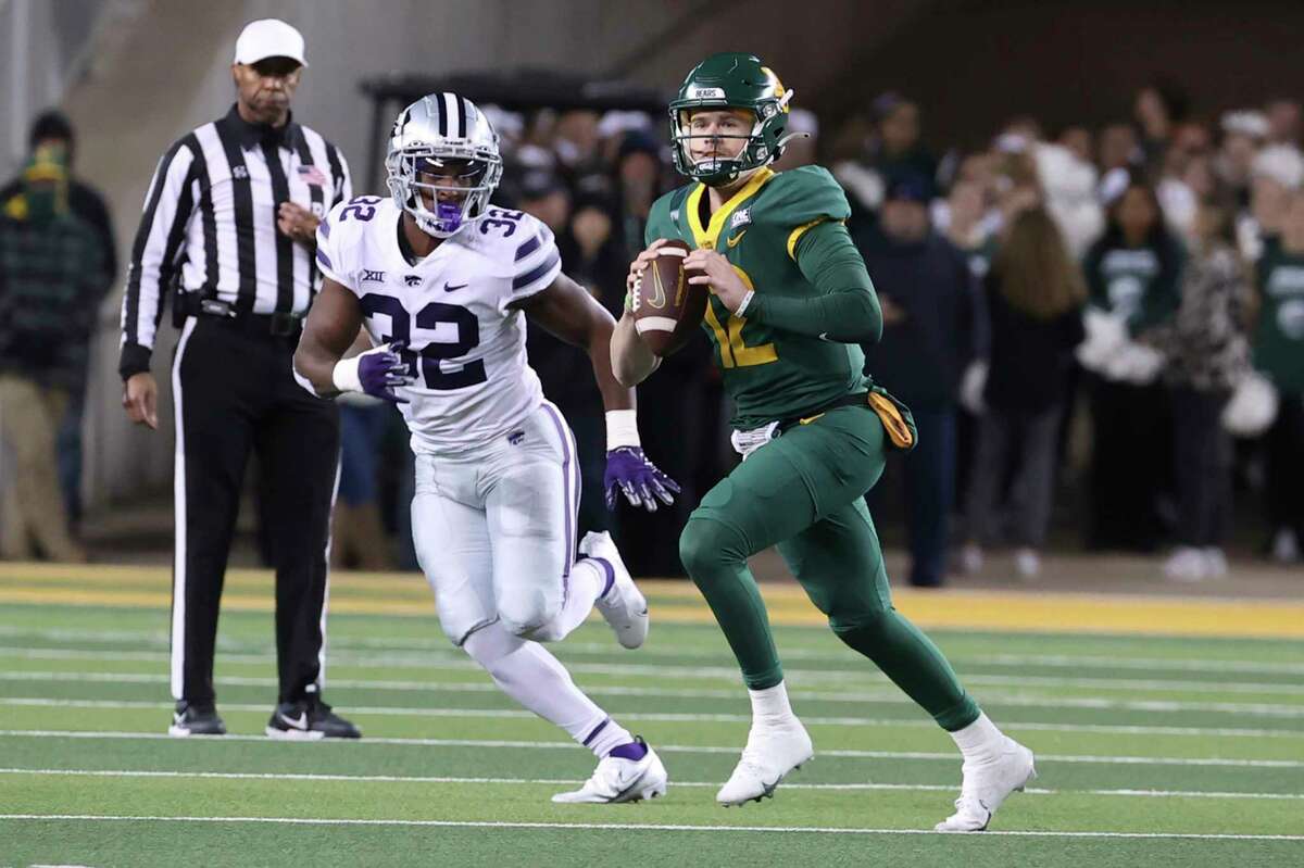Baylor quarterback Blake Shapen (12) runs by Kansas State linebacker Desmond Purnell (32) in the first half of an NCAA college football game, Saturday, Nov. 12, 2022, in Waco, Texas.