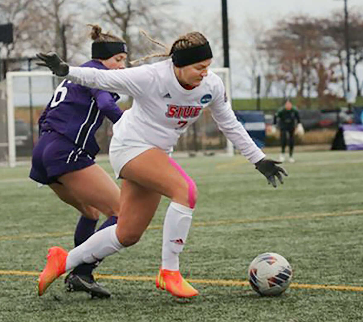 Lilly Schneiders of SIUE (7) dribbles past Nicole Doucette of Northwestern Saturday during NCAA Division I National Tournament opening-round action in Evanston.