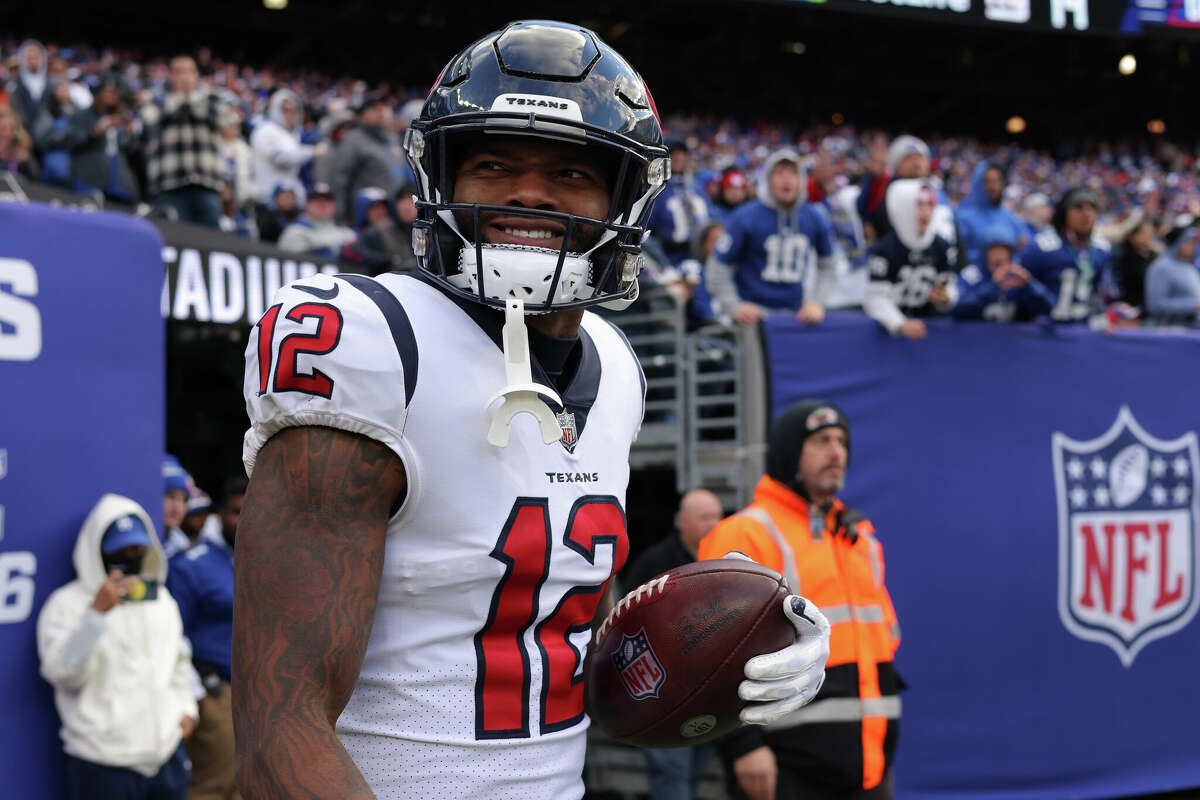 Nico Collins #12 of the Houston Texans reacts after a touchdown during the third quarter in the game against the New York Giants at MetLife Stadium on November 13, 2022 in East Rutherford, New Jersey.