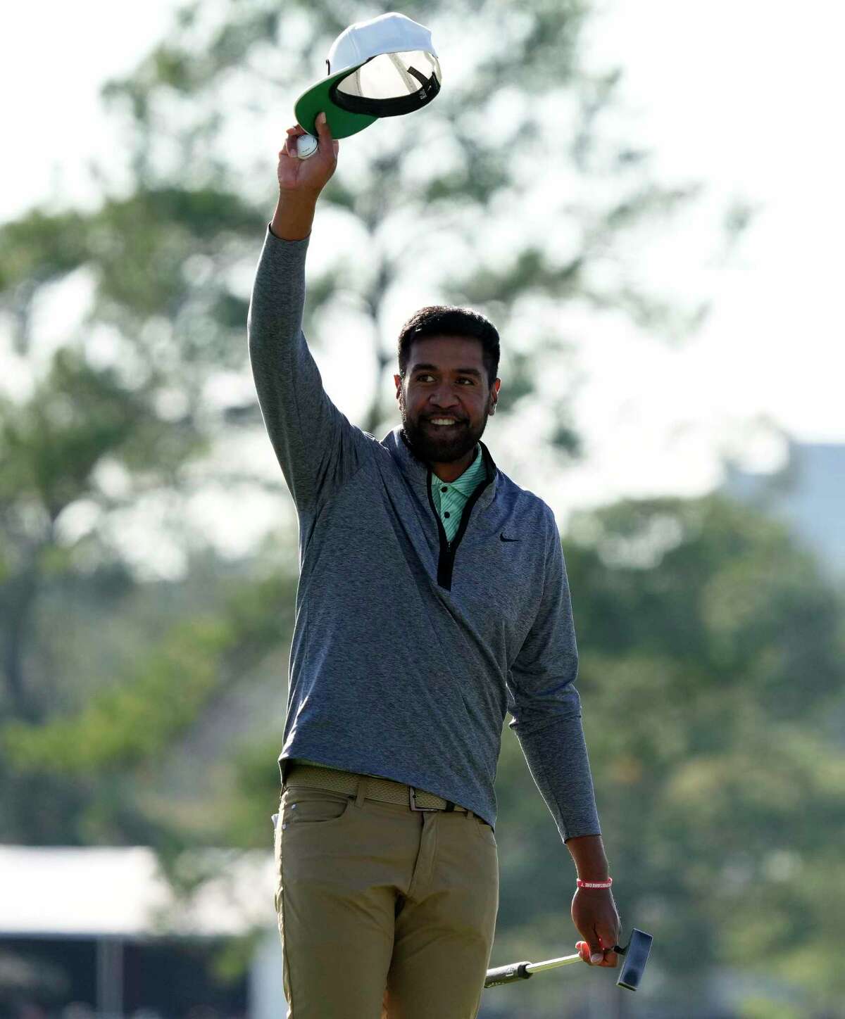 Tony Finau celebrates his win on the 18th hole during the final round of the Houston Open golf tournament, Sunday, Nov. 13, 2022, in Houston.