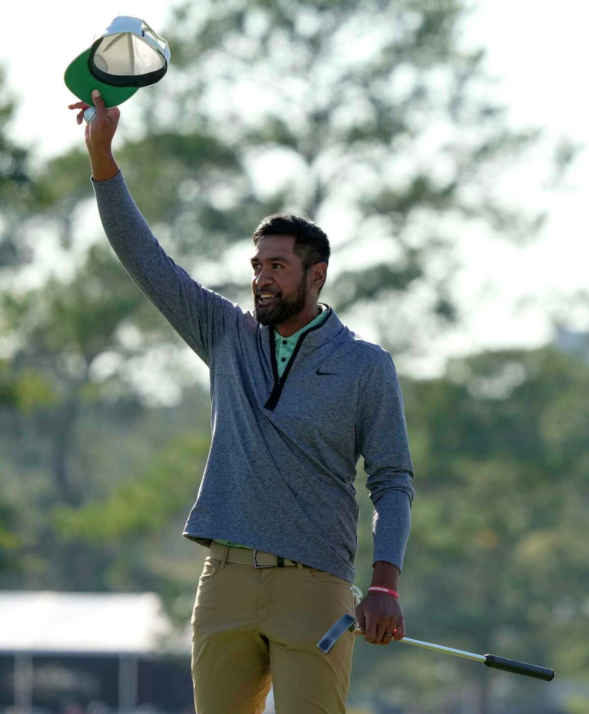 Tony Finau celebrates his win on the 18th hole during the final round of the Houston Open golf tournament, Sunday, Nov. 13, 2022, in Houston.
