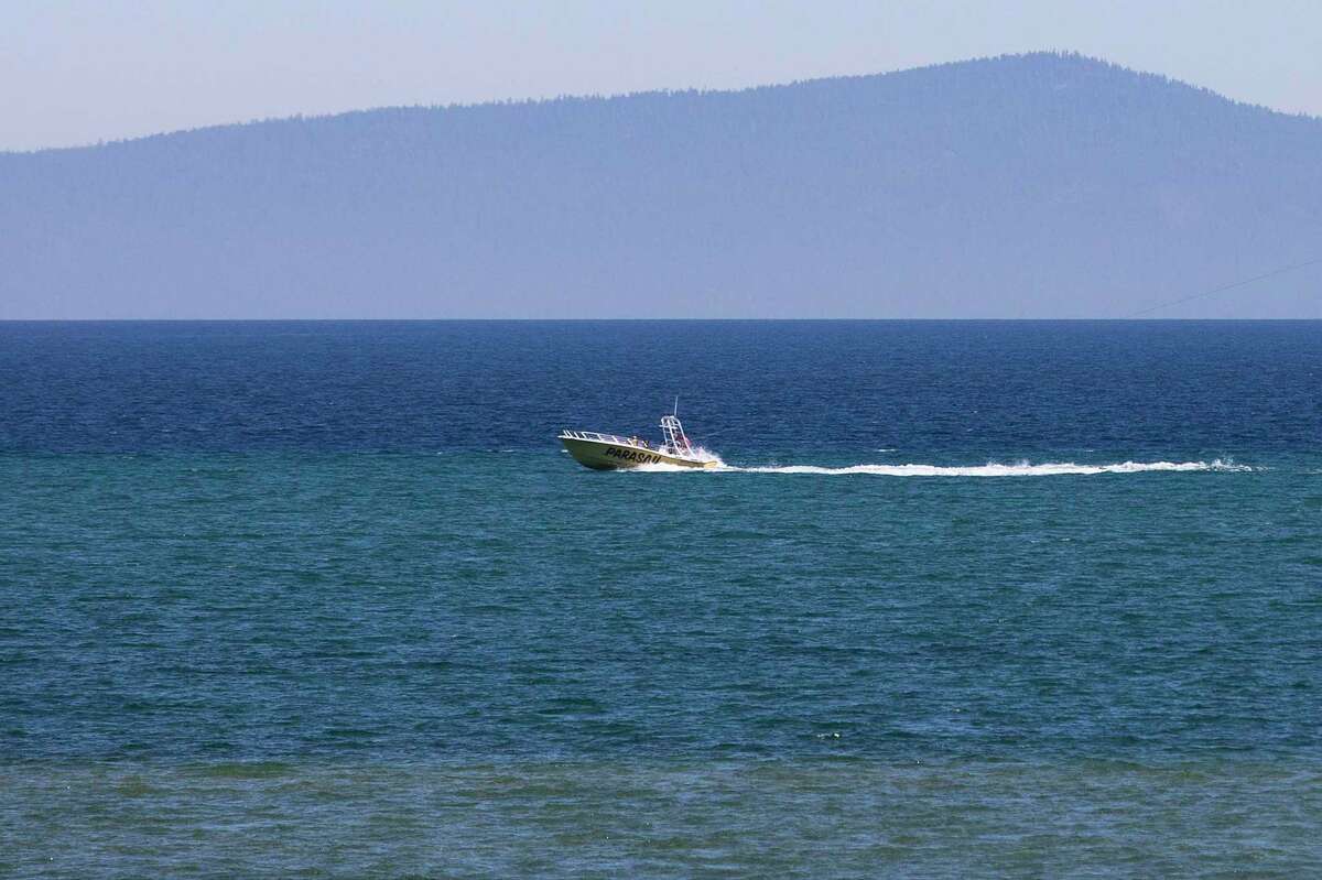 Distinct lines of clarity in the water can be seen from the shores of El Dorado Beach in South Lake Tahoe in July. Fodor’s Travel, a guide company, says that visitors should avoid Tahoe in order to give the heavily visited region, and the increasingly murky lake, a break.