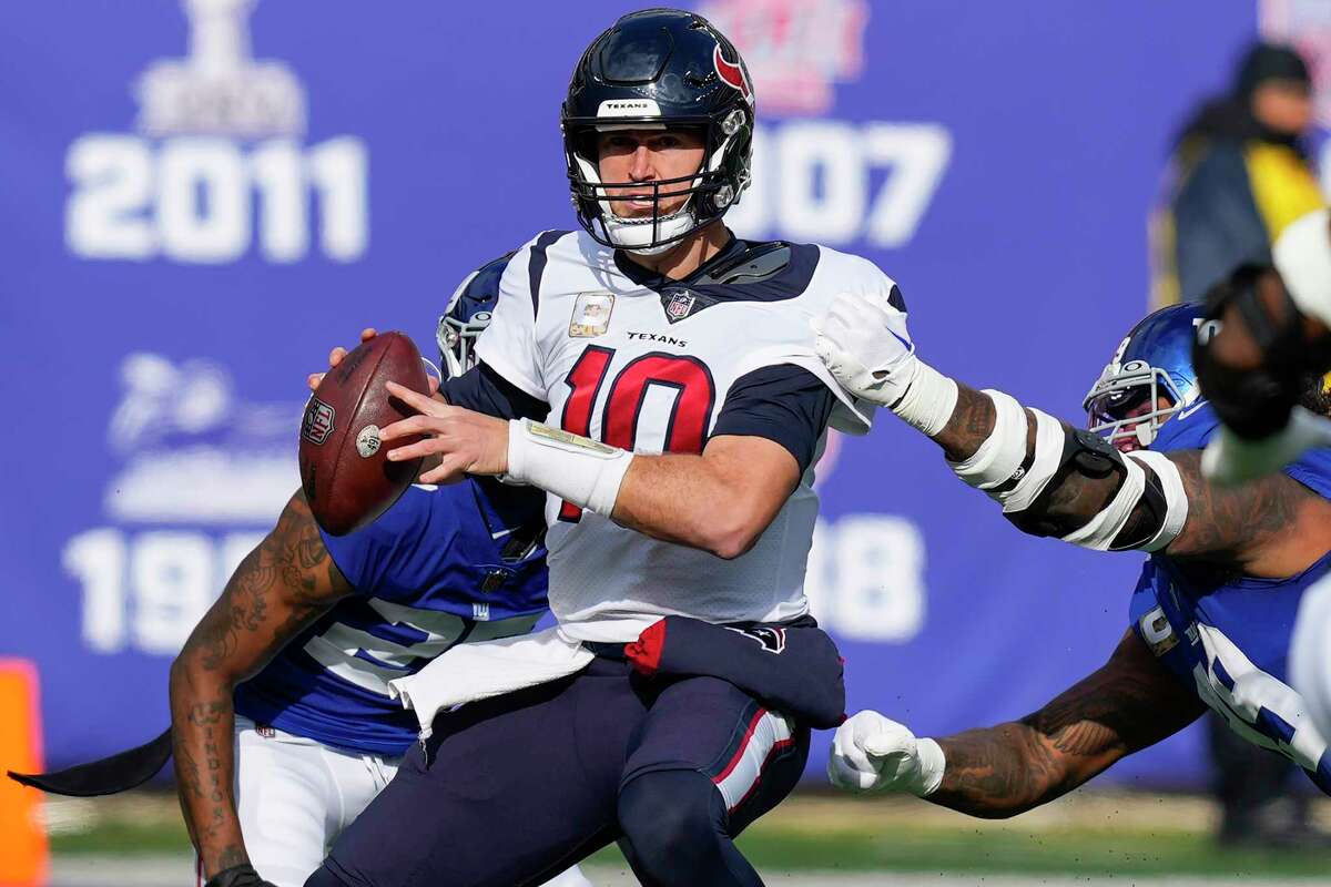 Texans quarterback Davis Mills goes down on one of the four sacks he suffered at the hands of the Giants on Sunday. 