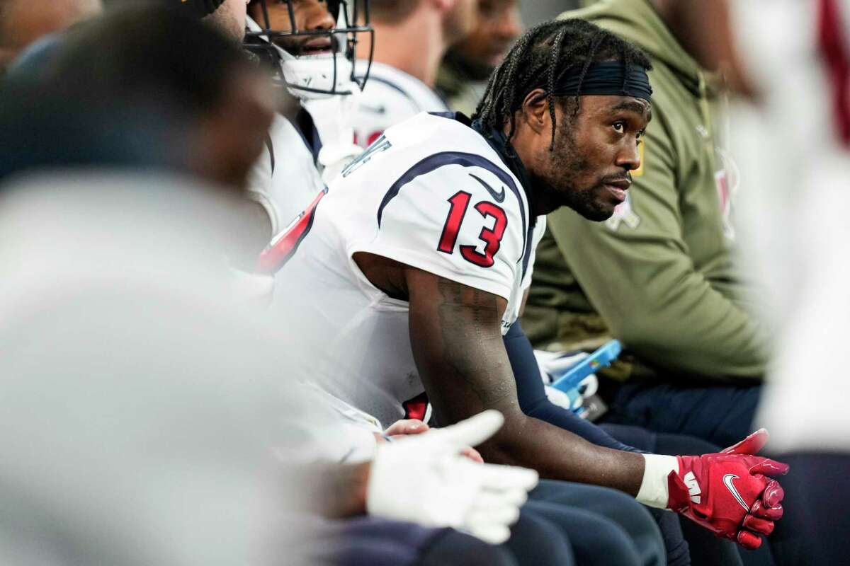 Houston Texans wide receiver Brandin Cooks (13) sits on the bench during the fourth quarter of an NFL football game against the New York Giants Sunday, Nov. 13, 2022, in East Rutherford, N.J.