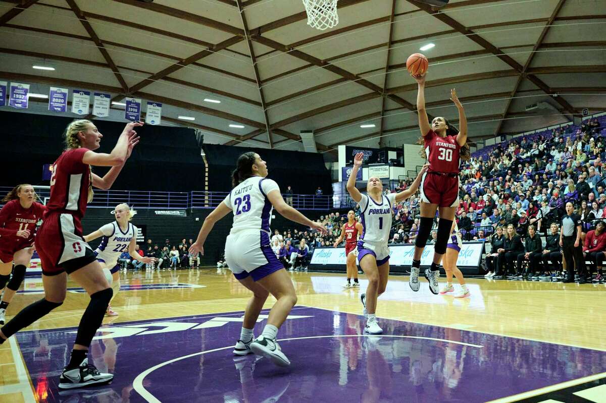 Stanford’s Haley Jones, who scored 17 points, rises above Portland guard McKelle Meek (1) to launch a shot during the Cardinal’s victory.