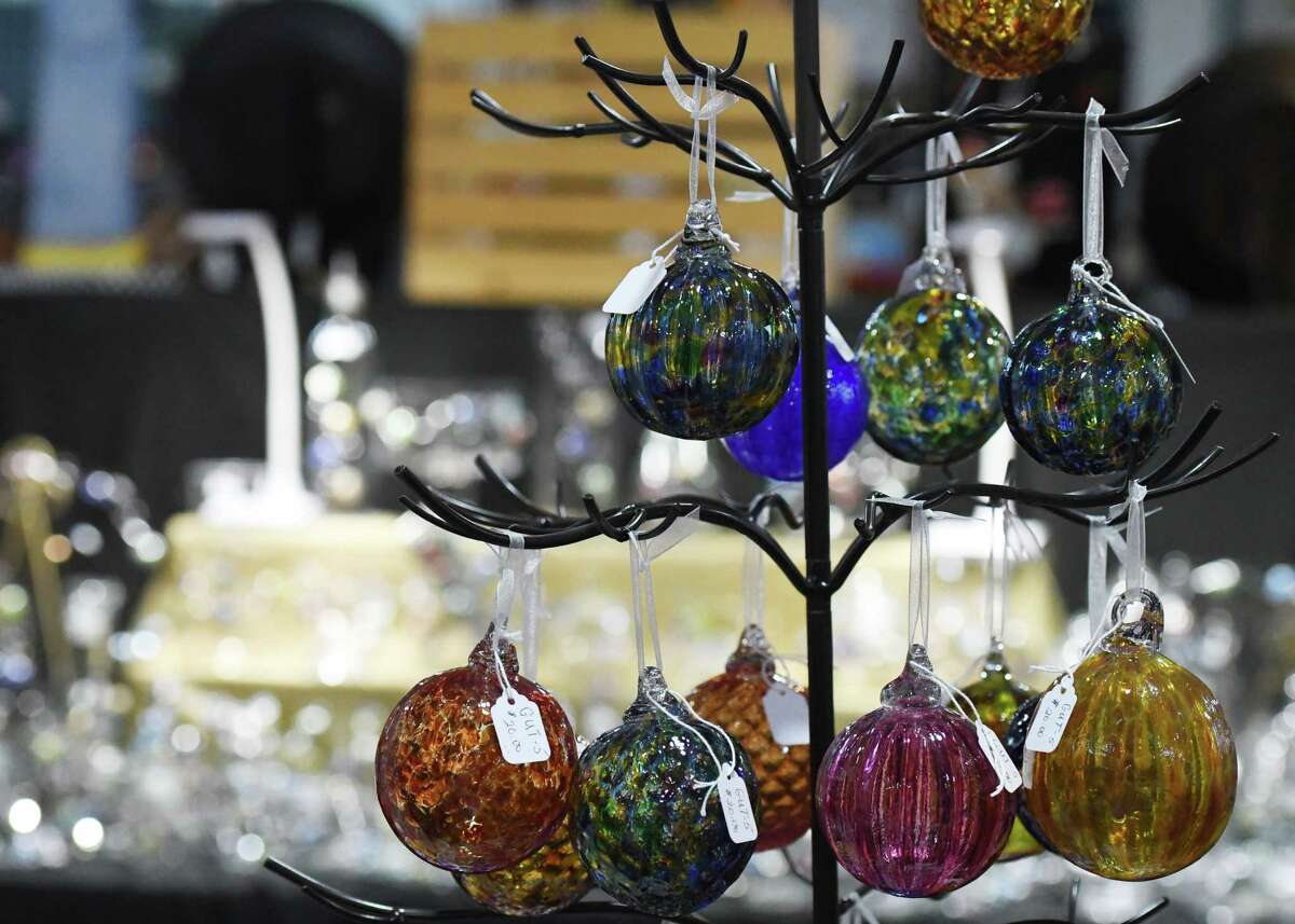 Glass decoration are offered for sale during the Shaker Heritage Society’s annual holiday market on Friday, Nov. 11, 2022, in Colonie, N.Y. The seasonal market featuring regional artisans runs through Dec. 18.