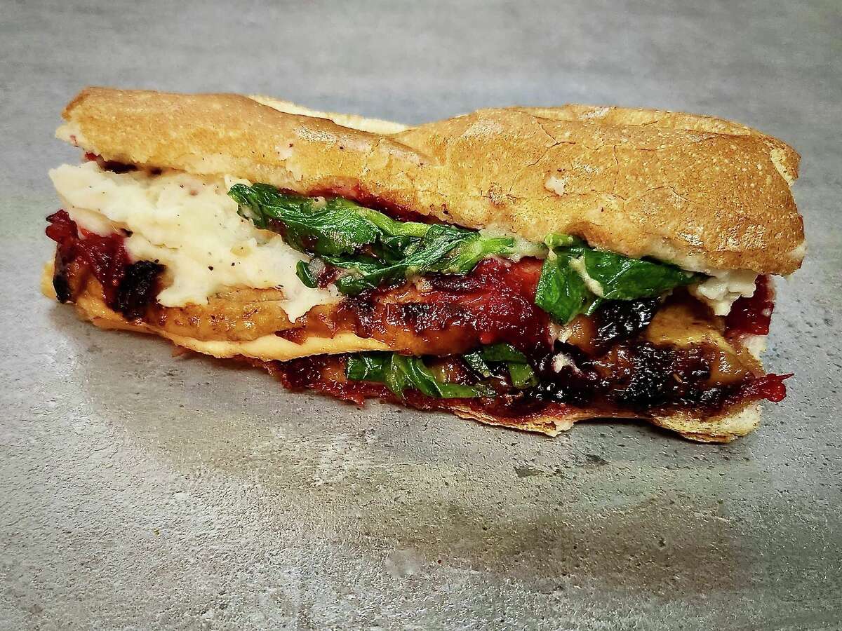 Phat Eatery's Thanksgiving "leftover' sanwich packs a punch of sweetness with sake cranberry sauce.