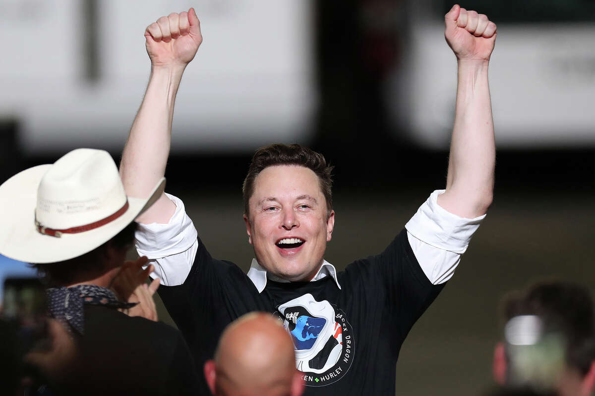 SpaceX founder Elon Musk celebrates after the successful launch of the SpaceX Falcon 9 rocket with the manned Crew Dragon spacecraft at the Kennedy Space Center on May 30, 2020, in Cape Canaveral, Florida.