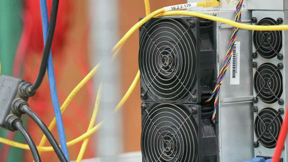 Bitcoin mining machines in the development area of Lancium on Monday, Nov. 14, 2022 in Houston. The Houston-based company will launch its platform this week that will allow bitcoin mining operations and data center to ramp down their power usage automatically to respond to tight grid conditions