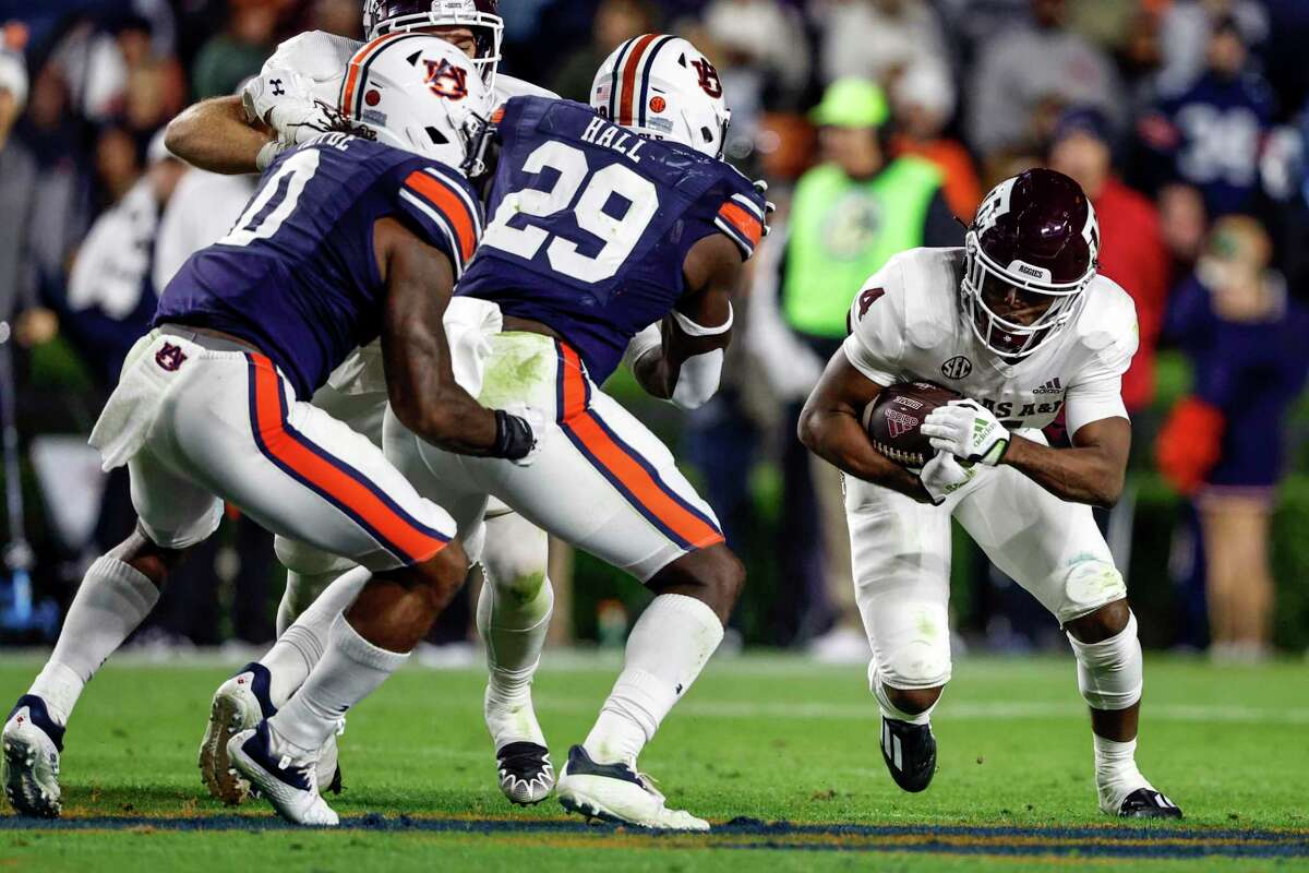 Texas A&M running back Amari Daniels is bottled up by the Auburn defense in the Aggies’ latest loss.