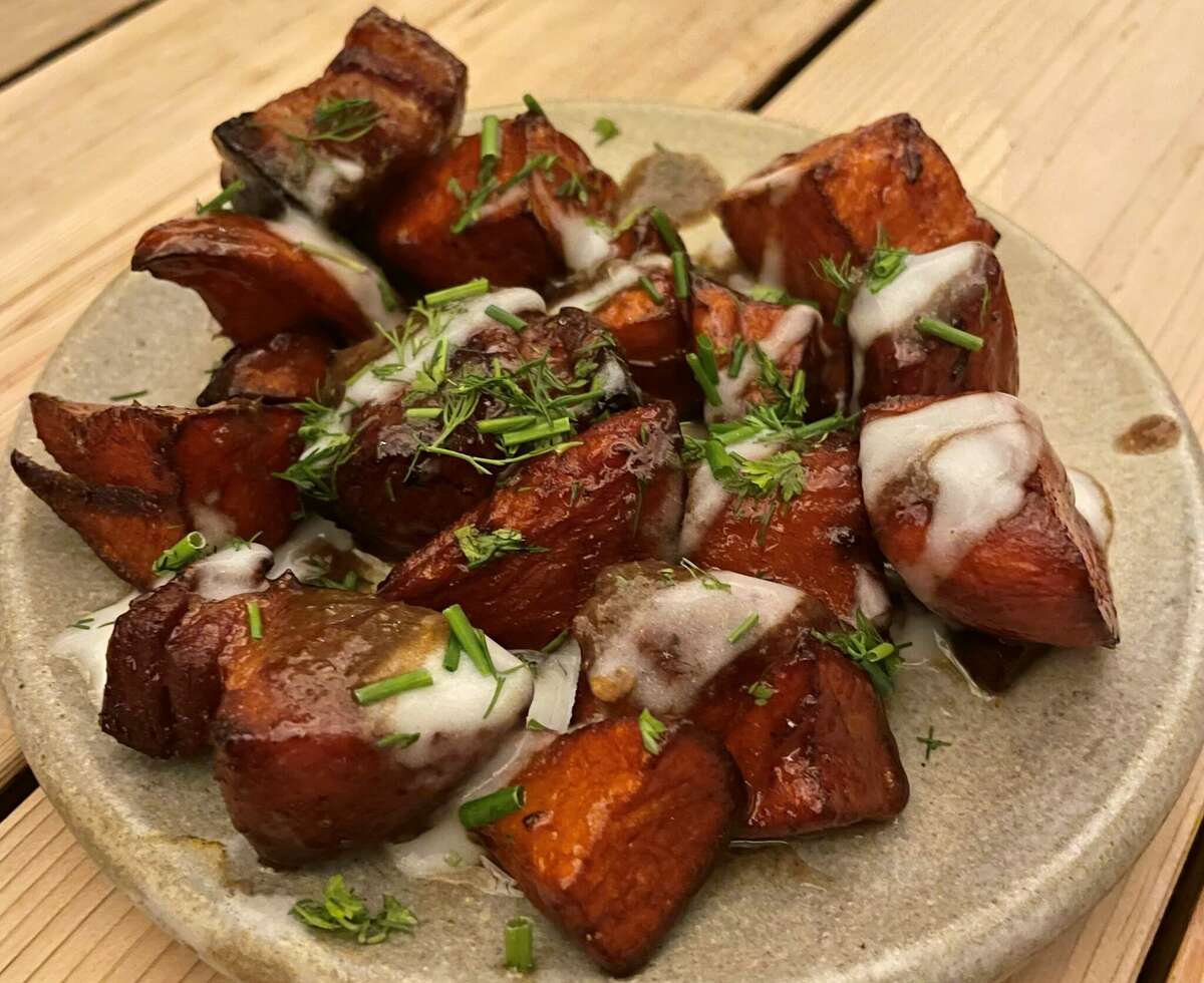 Squable's roasted sweet potatoes with pork belly, honey butter, black garlic and buttermilk