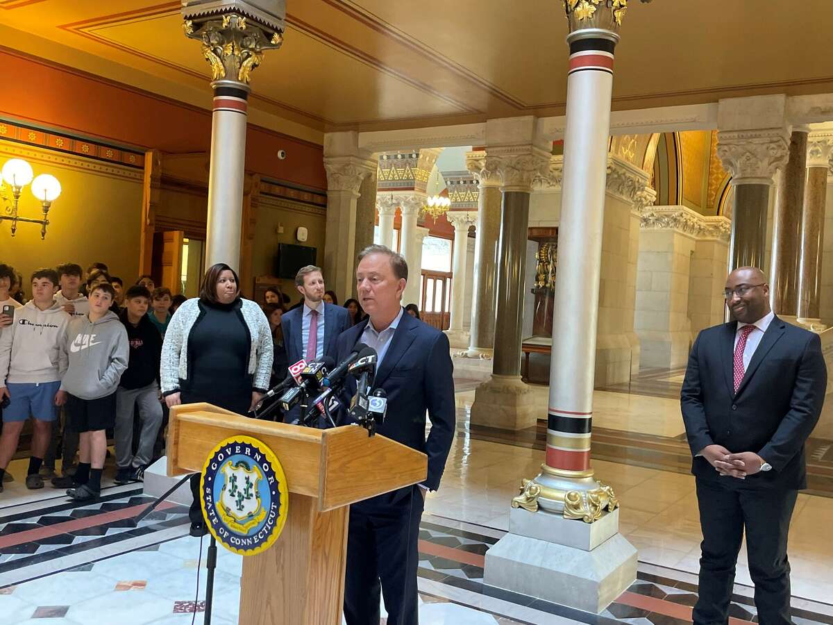 Gov. Ned Lamont announces the departure of his chief of staff Paul Mounds, right, and general counsel counsel, Nora Dannehy, Tuesday at a press conference at the state Capitol in Hartford. Natalie Braswell, far left, who has served as interim Comptroller, will succeed Dannehy. Jonathan Dach, second from left, deputy chief of staff, will succeed Mounds.
