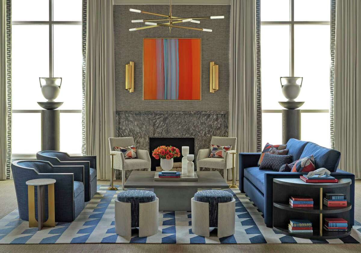 Houston interior designer Benjamin Johnston of Benjamin Johnston Design has a new collection of furniture with Chaddock Furniture Workroom. His pieces are modern interpretations of neoclassical forms with midcentury influences. This photo shows a Bruno sofa, Dario dining chair (white), Franco swivel chair (blue), Ugo accent table next to the swivel chairs, 2 Rocco stools, Titus cocktail table in the center, and 2 Dante pedestals. Terzo end table at the end of the sofa.