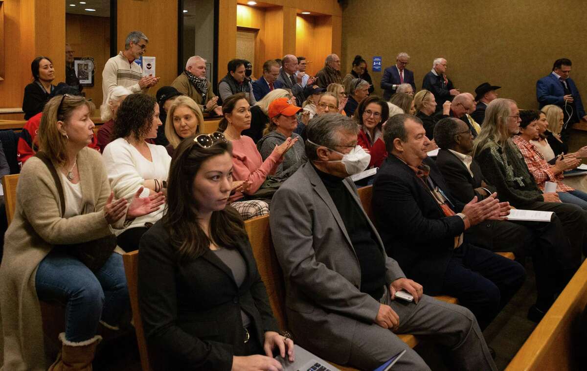 The audience react to a speaker questioning the integrity of the midtern election at the Harris County Commissioners Court Tuesday, Nov. 15, 2022, in Houston.