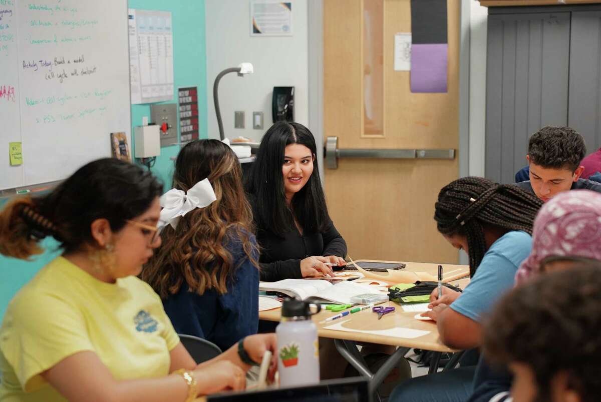 DeBakey High School senior Marrthella Diaz, center, works on creating a two-dimensional model of the cell cycle in Ms. Marla Maharaj’s AP Biology class on November 11, 2022 in Houston, Texas.