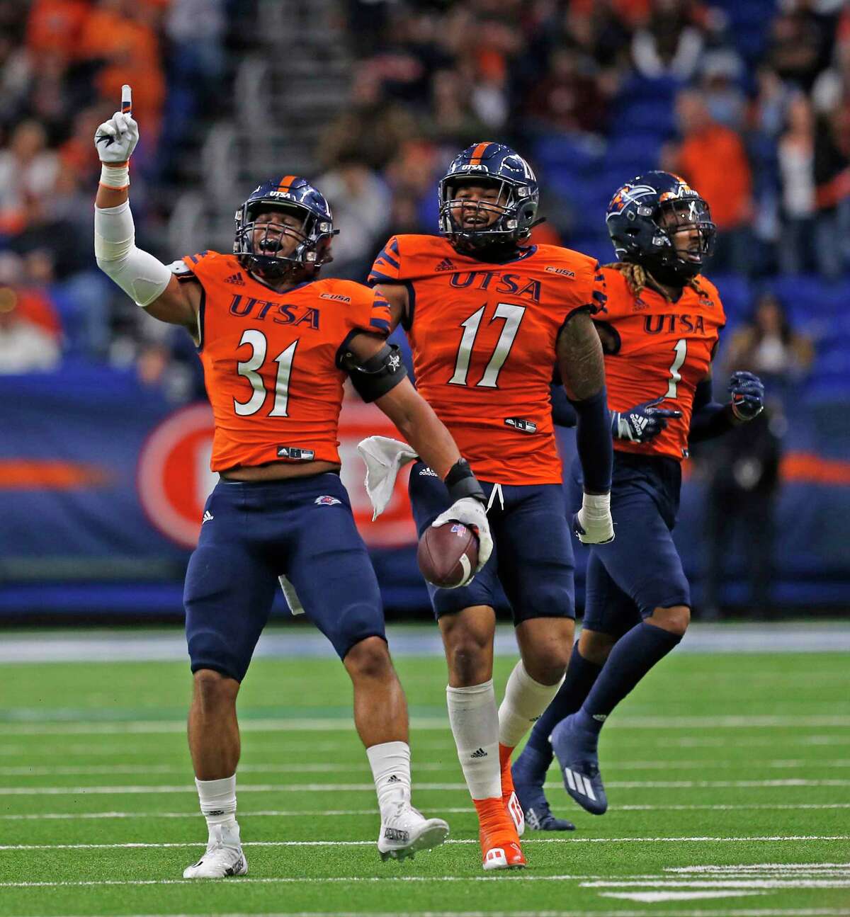 SAN ANTONIO, TX - NOVEMBER 12: Linebacker Trey Moore #31 of the UTSA Roadrunners celebrates after stripping the ball from Landry Lyddy #18 of the Louisiana Tech Bulldogs (not in frame) in the second half at Alamodome on November 12, 2022 in San Antonio, Texas. (Photo by Ronald Cortes/Getty Images)