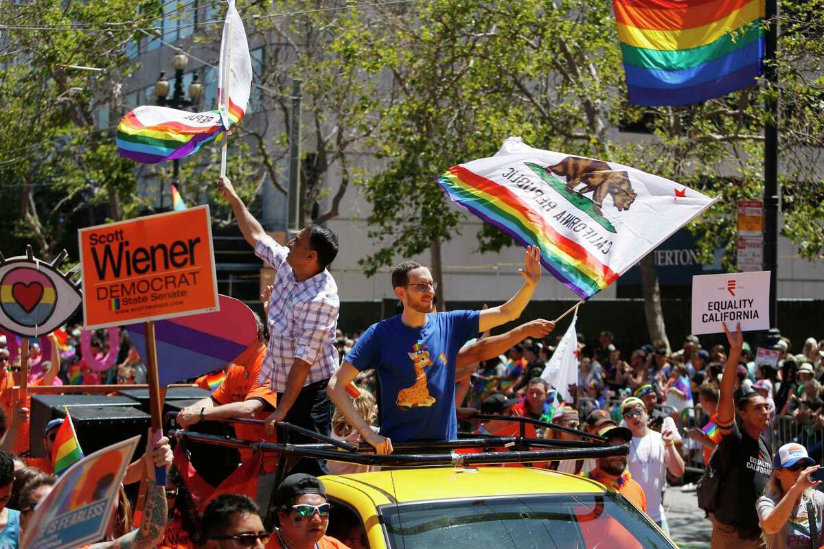 Sen. Scott Wiener waves to the crowd during the 2018 Pride Parade in San Francisco. After the November 2022 election, more than 10% of the next Legislature will be lesbian, gay or bisexual.