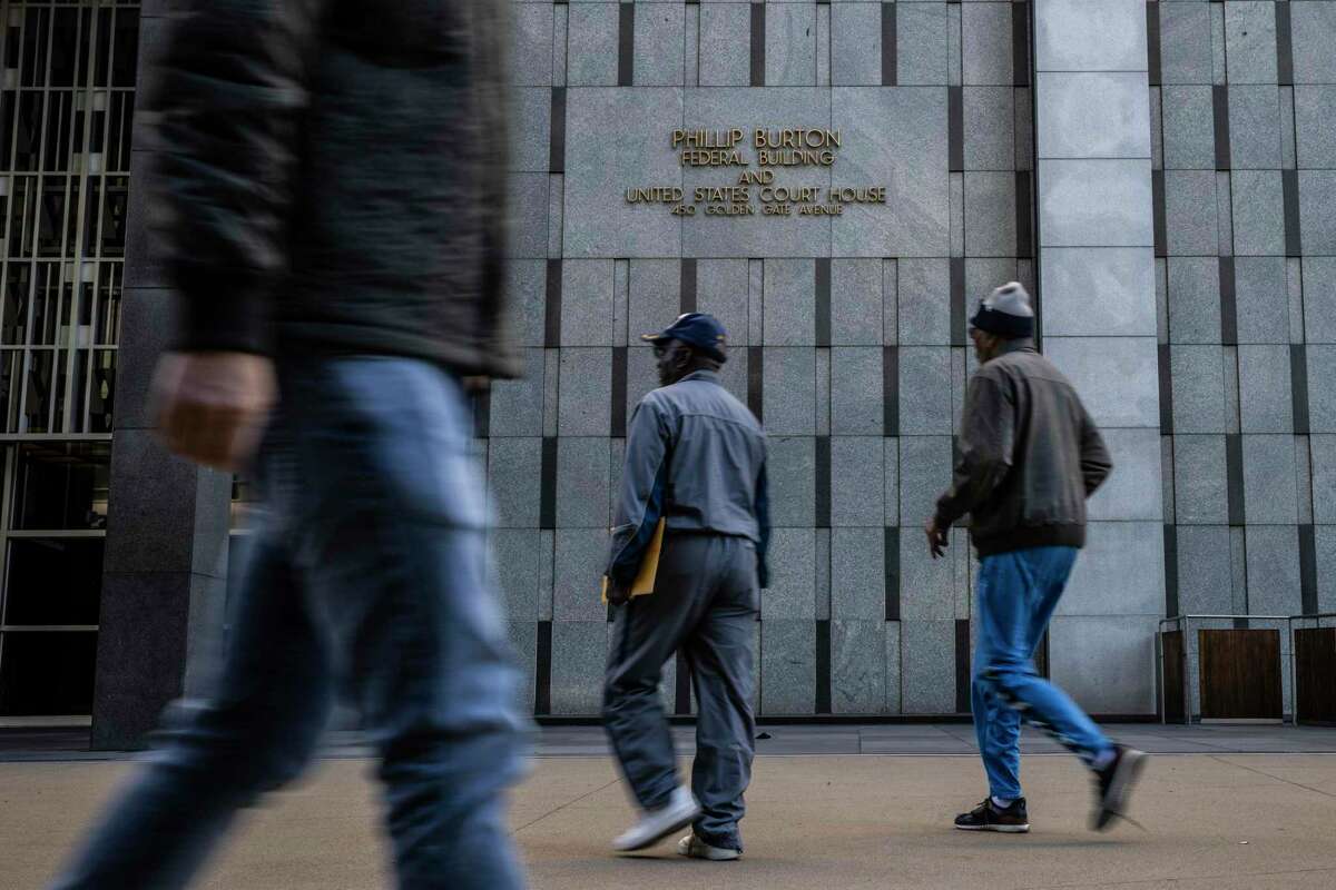 Pedestrians walk outside Philip Burton Federal Building and United States Court House in San Francisco, California Tuesday, Nov. 15, 2022.