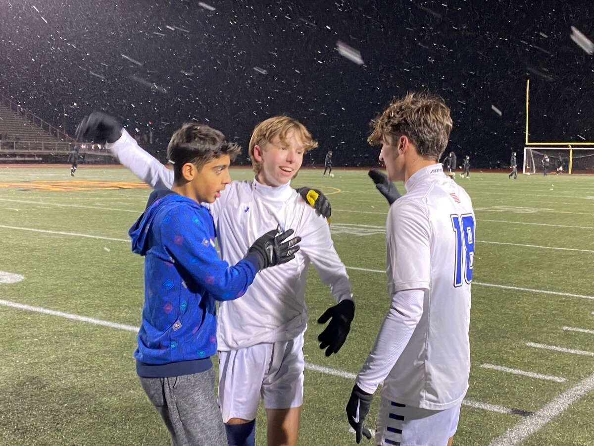 Pete Wisialowski (center) converted the penalty kick that sent Old Saybrook into the Class S title game. At right is Rams senior captain Cameron DeAngelo.