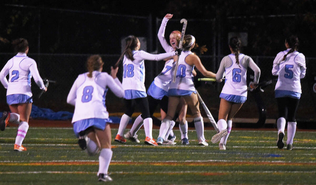 Wilton celebrates Riley Fitzgerald's goal against New Canaan during the CIAC Class L field hockey semifinals in Norwalk on Tuesday, Nov. 15, 2022.