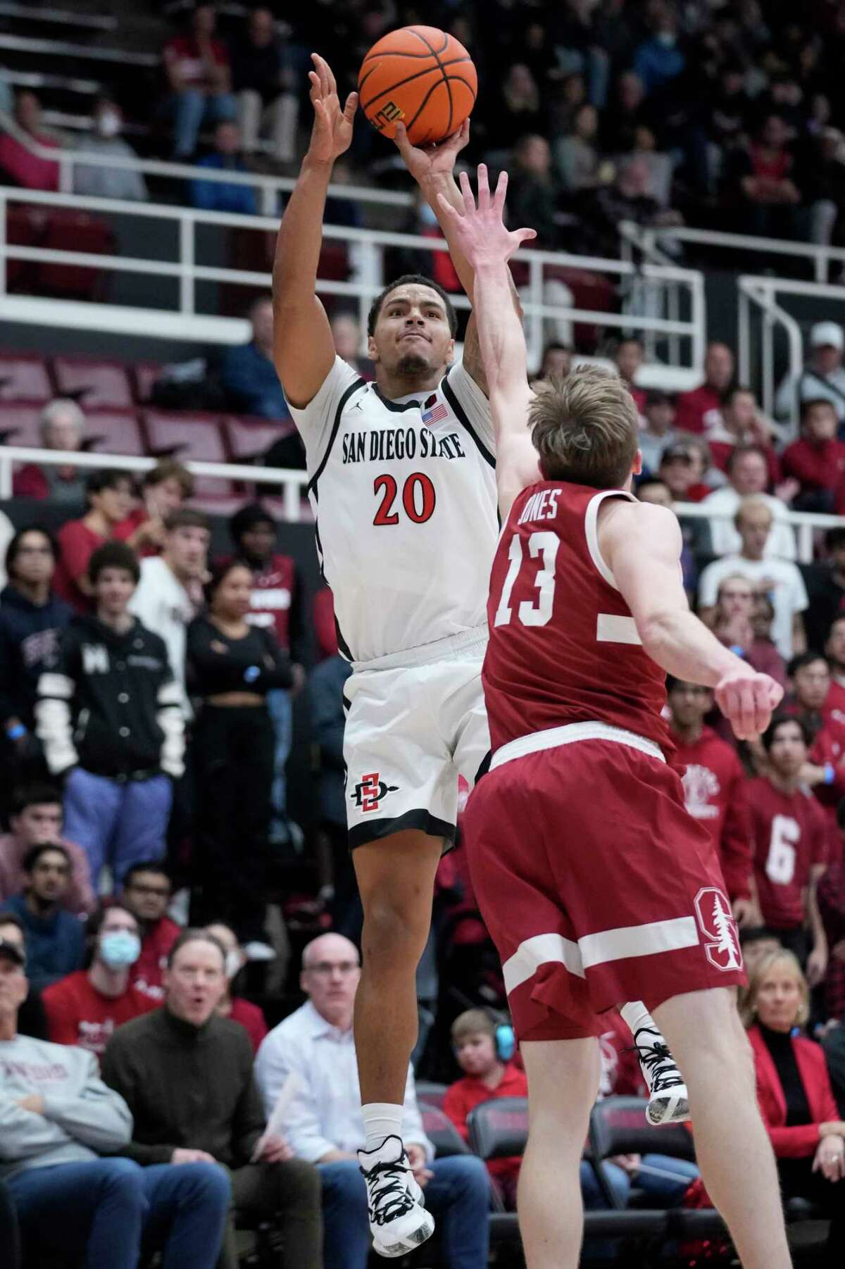San Diego State guard Matt Bradley (20) shoots over Stanford guard Michael Jones (13) during the first half of an NCAA college basketball game in Stanford, Calif., Tuesday, Nov. 15, 2022. (AP Photo/Godofredo A. Vásquez)