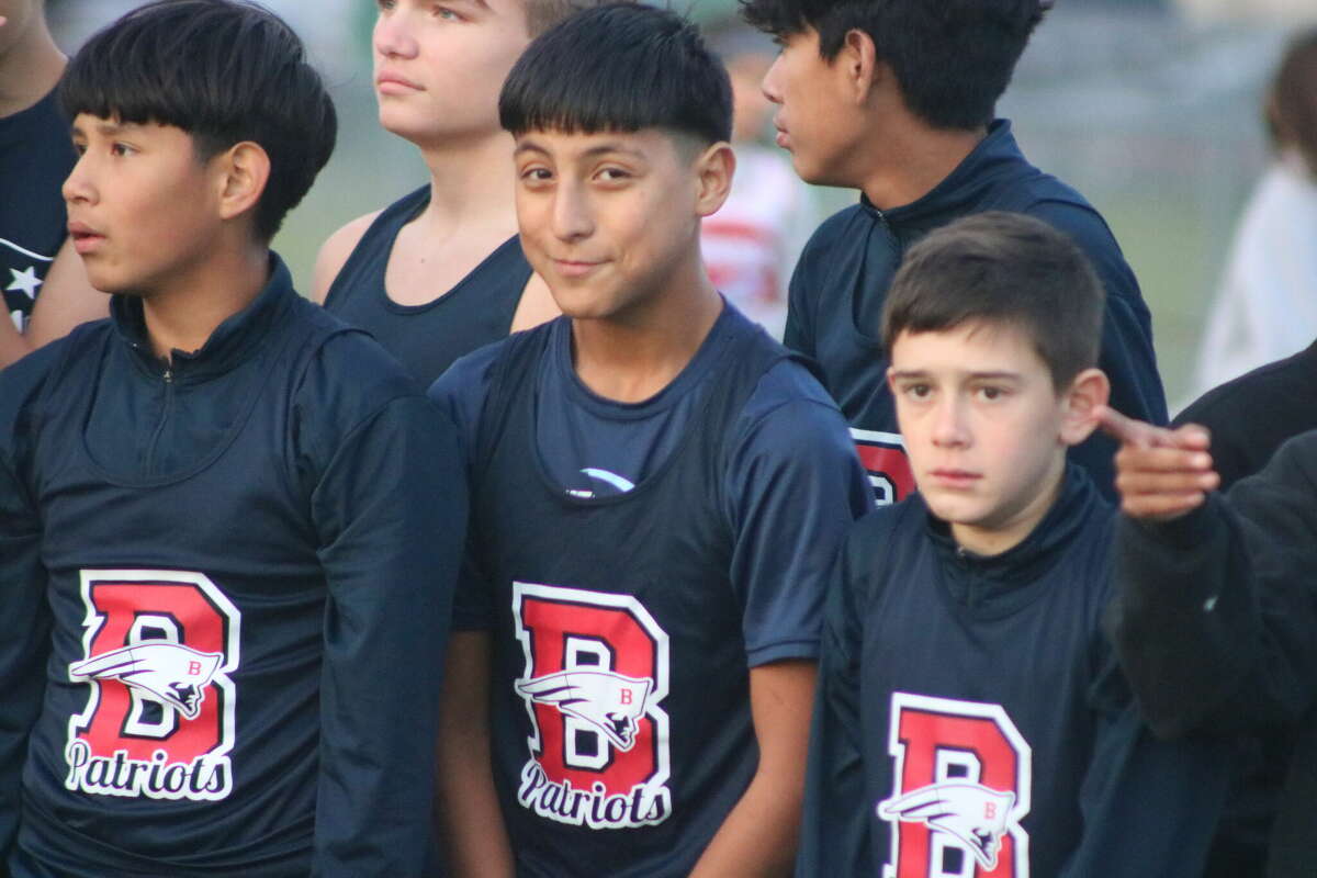 The Bondy trio of (L-R) Jacob Facundo, Melky Fernandez and Ludvie Lay await the start to the seventh grade race Tuesday. Facundo and Fernandez were among the scorers, helping the Patriots win the district crown.