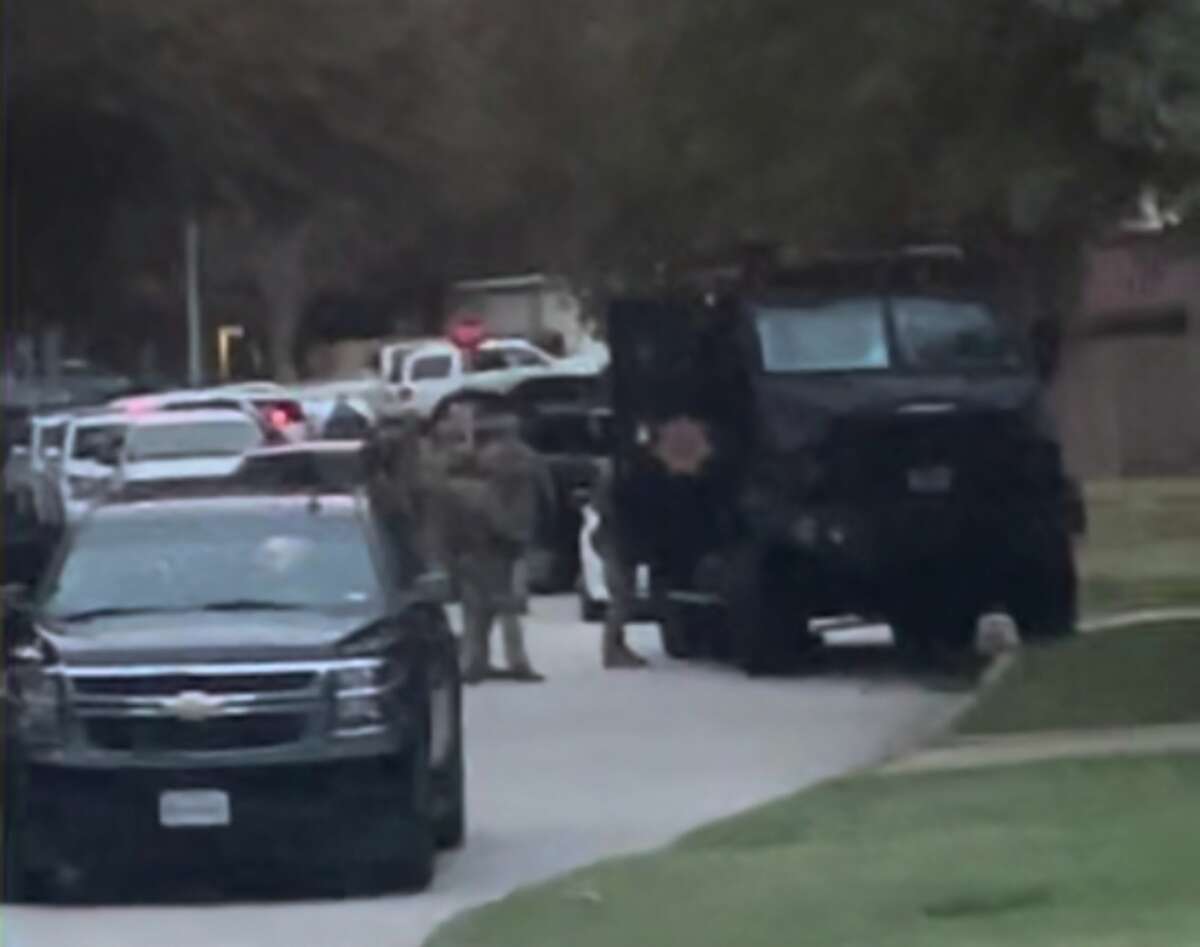Deputies surround a home in the 14600 block of Meredith Gate Circle in northeast Harris County, Texas on Nov. 16, 2022.