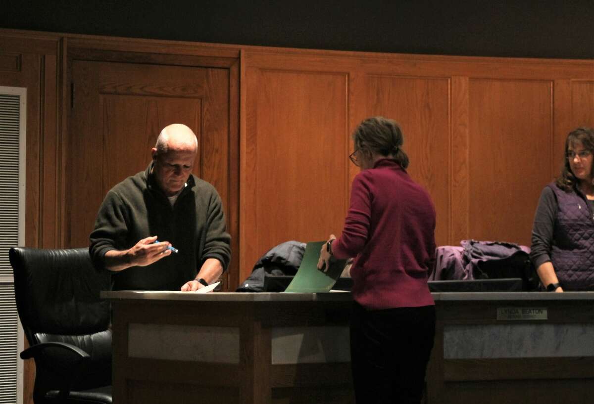 Dave Bachman, 1st District council member, is sworn in Tuesday during Manistee City Council's organizational meeting.