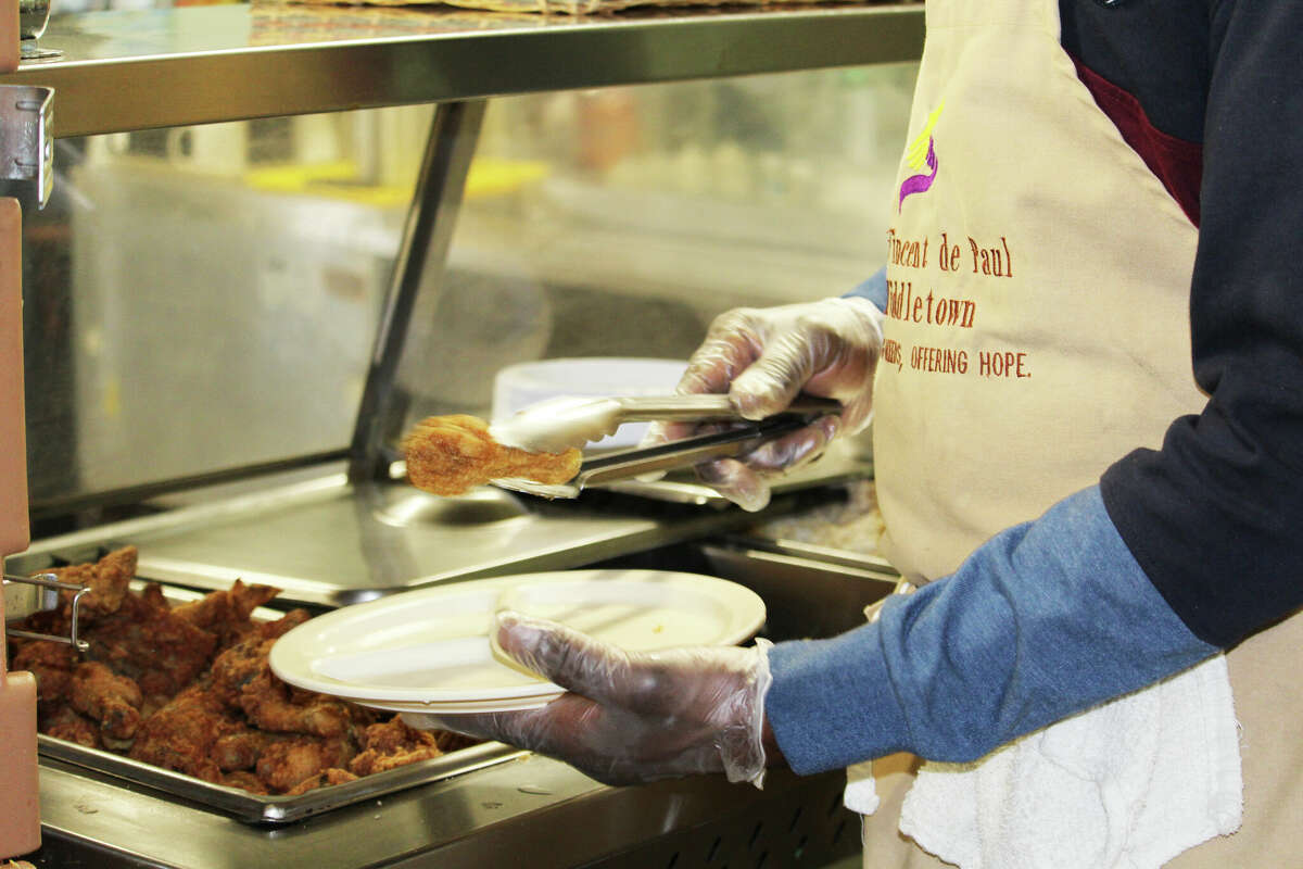 A fried chicken lunch is served Wednesday afternoon at the St. Vincent de Paul Middletown soup kitchen at 617 Main St.