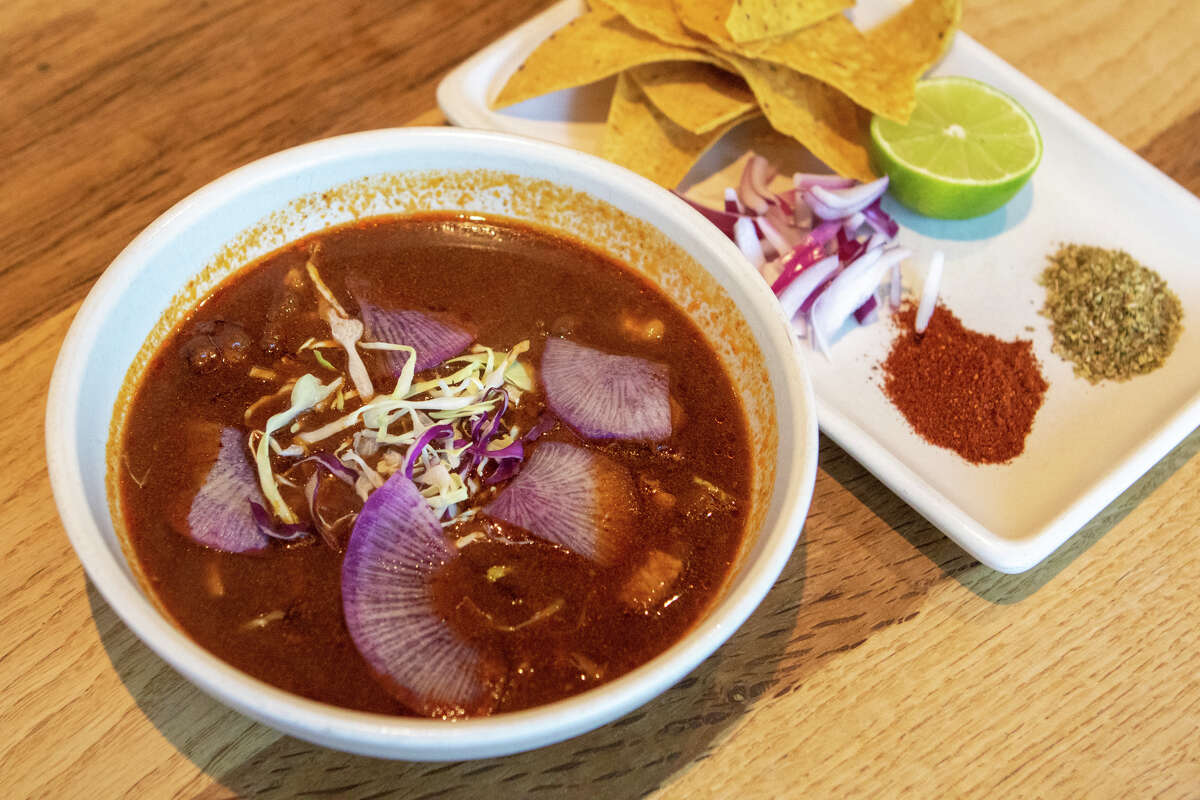 Gonzalo Guzman, chef-owner of Nopalito, offers classic red pozole at his San Francisco restaurant. The traditional stew is served with fried tortilla chips, purple radish, chopped onion, lime, and Nopalito spices. 