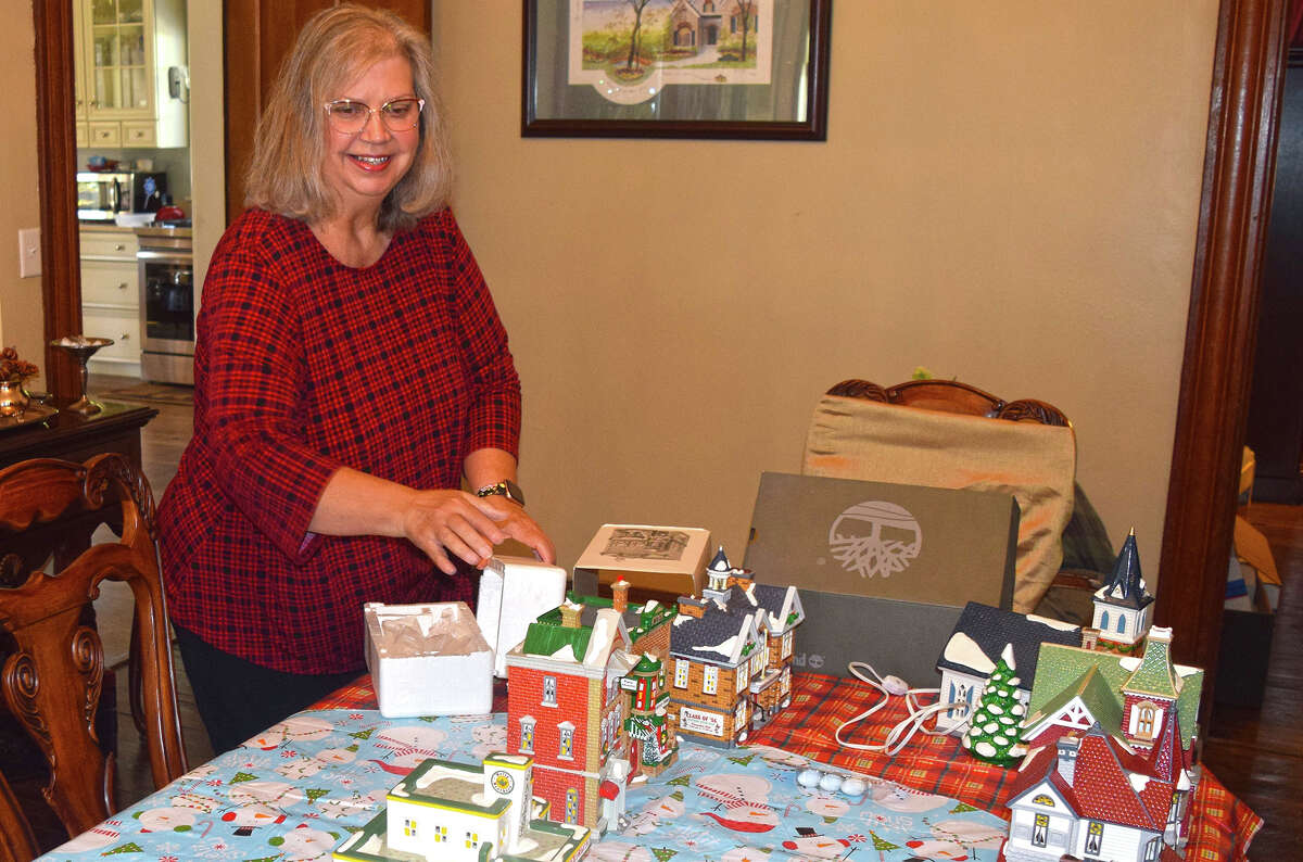 Gwen Eyer, owner and innkeeper of Blessings on State Bed and Breakfast, unpacks Christmas decorations during what she calls Elf Week, when she decorates for the holidays.