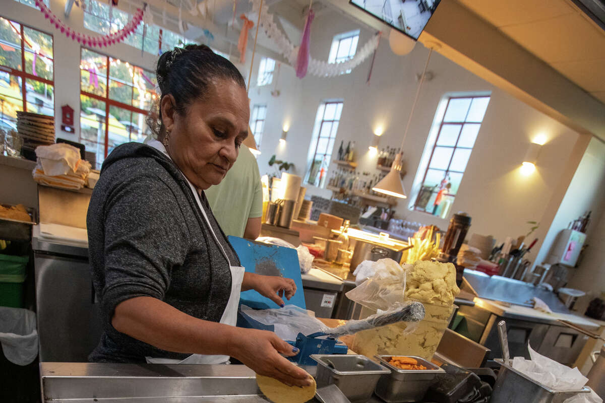 Kitchen staff member Panfila Soltera makes tortillas at Bombera in Oakland, on Monday Nov. 14, 2022.