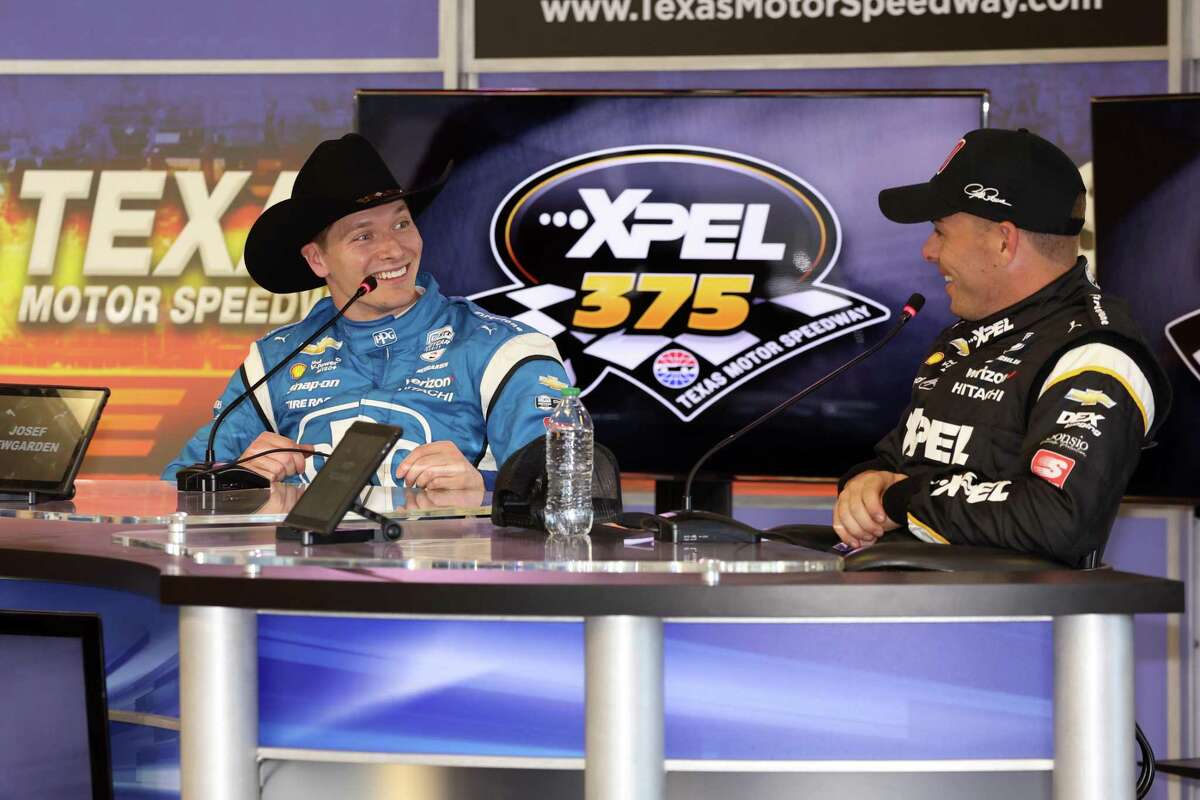 Xpel Inc. raised its profile among car enthusiasts by entering into a multiyear partnership with the Texas Motor Speedway in 2021 to be the title sponsor of a race named the Xpel 375. Pictured are Josef Newgarden, left, driver of the No. 2 PPG Team Pensk Chevrolet, and Scott McLaughlin, driver of the No. 3 Xpel Team Penske Chevrolet.