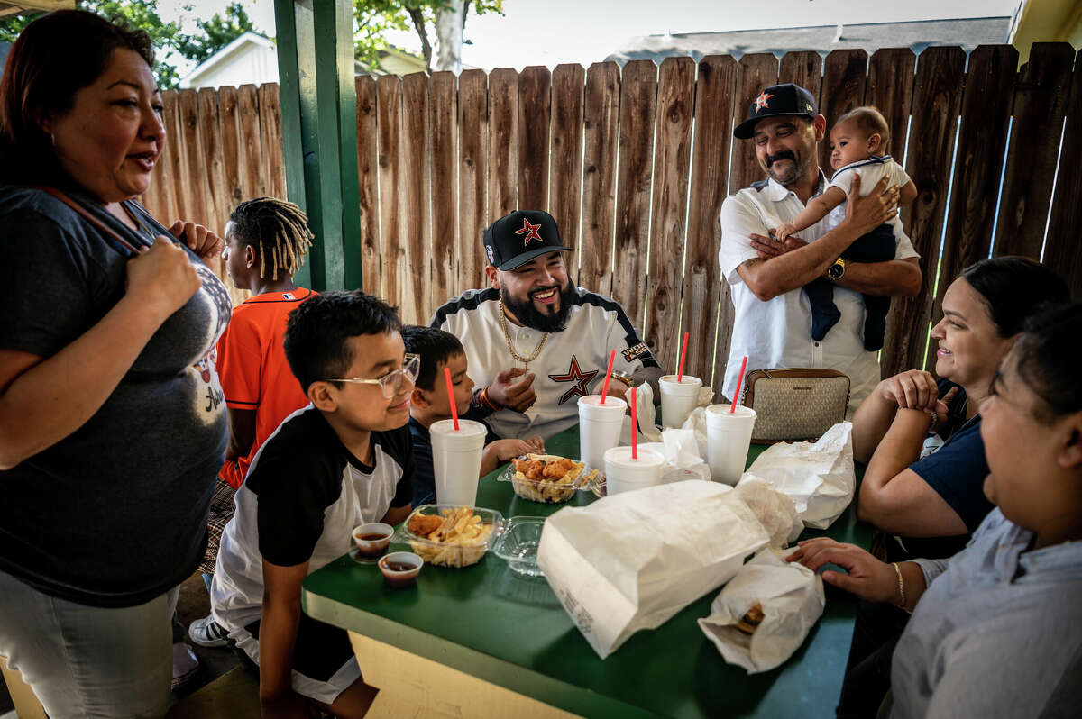 Three generations of the Garcia family, who were all born and raised in the Second Ward, share a meal together at Champ Burger on Saturday, November 5, 2022 in Houston, Texas. Founded in 1963, it has been a prominent gathering place in the Second Ward for nearly sixty years. The family who owns Champ Burger recently sold some nearby property to Concept Neighborhood to build out its 17-acre district, although Champ Burger itself will remain a vital part of the new corridor, called The Plant/Second Ward.