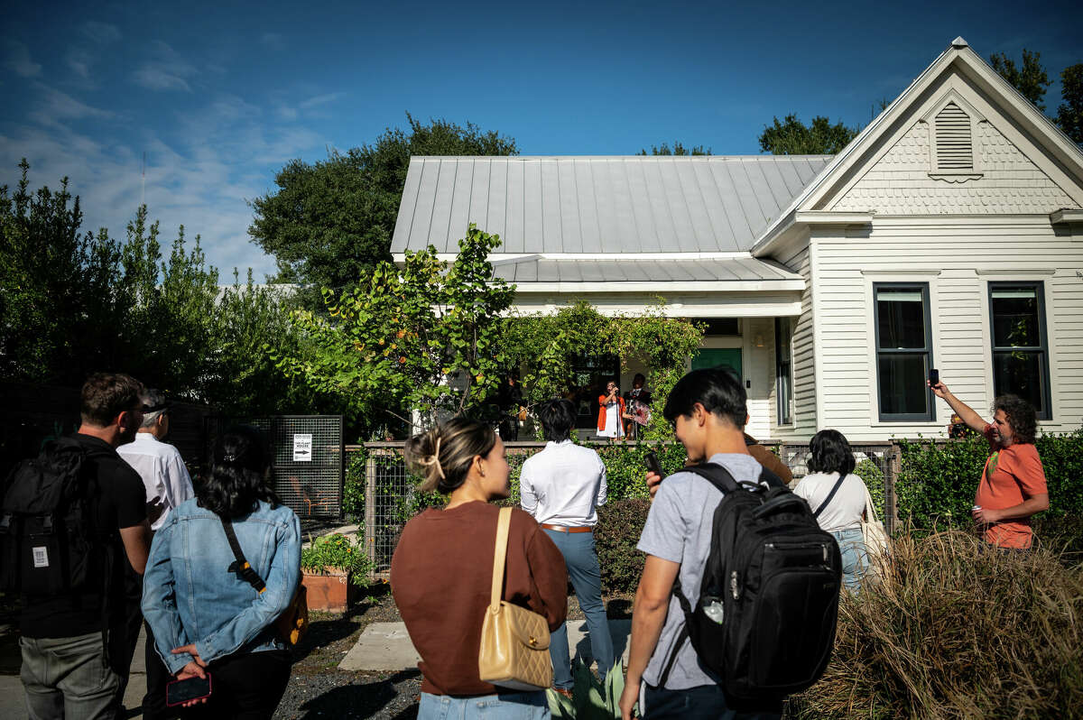 Andrea Daniela performs live music during a block party with her jazziachi band on the front porch of The Plant House, a renovated 1890s house and AirBnB rental in the heart of Concept Neighborhood's development project in the Second Ward, on Saturday, November 5, 2022 in Houston, Texas. She was born and raised in the Second Ward and works as a broker and social media manager at Concept Neighborhood. 