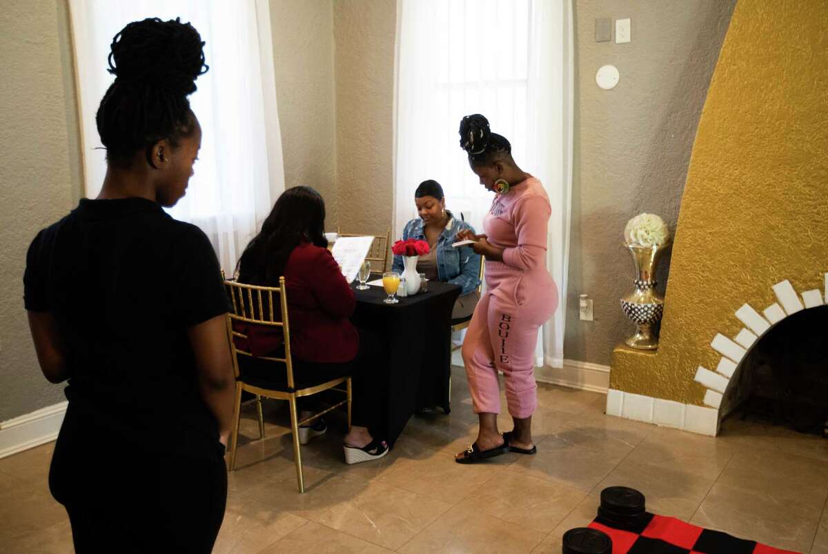 Jasmyne Wilson, left, 21, and her mother Tiffeny Wilson, 39, tend to their guests at Etc HTX Brunch, Sunday, Nov. 13, 2022, in Houston. etc HTX Manor is a private venue which provides space for events and on the second floor of the space it houses The Beauty Bar.