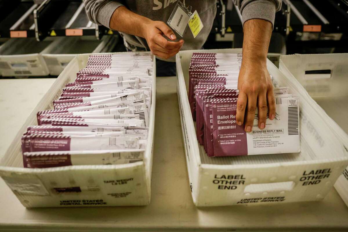 A City Council race in Richmond has resulted in an exact tie that is expected to be resolved by a local official drawing someone’s name from an envelope. This Nov. 9 file photo shows ballots at San Francisco City Hall.