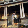 Allison Waggener and Erik Kuranko pose with their one-week-old daughter on the front porch of Graynook, their home in Bridgeport, Conn. Nov. 16, 2022. Waggener is the recipient of the 2022 Edward F. Gerber Urban Preservation Fund, which the couple will put towards the continued restoration of the house, built in 1895.
