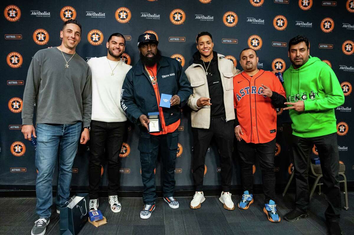 Astros players Jason Castro, Lance McCullers Jr., Jeremy Peña stand with Trae Tha Truth and Ice Man Nice after receiving their gift of a diamond custom piece and necklace for the World Series Championship. Wednesday November 16, 2022