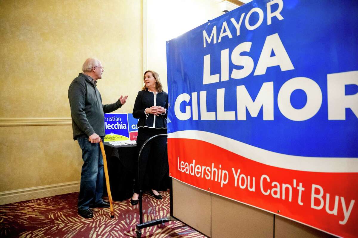 Santa Clara Mayor Lisa Gillmor speaks with supporter Rob Mezzetti during an election night gathering on Tuesday, Nov. 8, 2022, in Santa Clara, Calif. Gillmor has been an outspoken critic of the 49ers and the City Council majority.