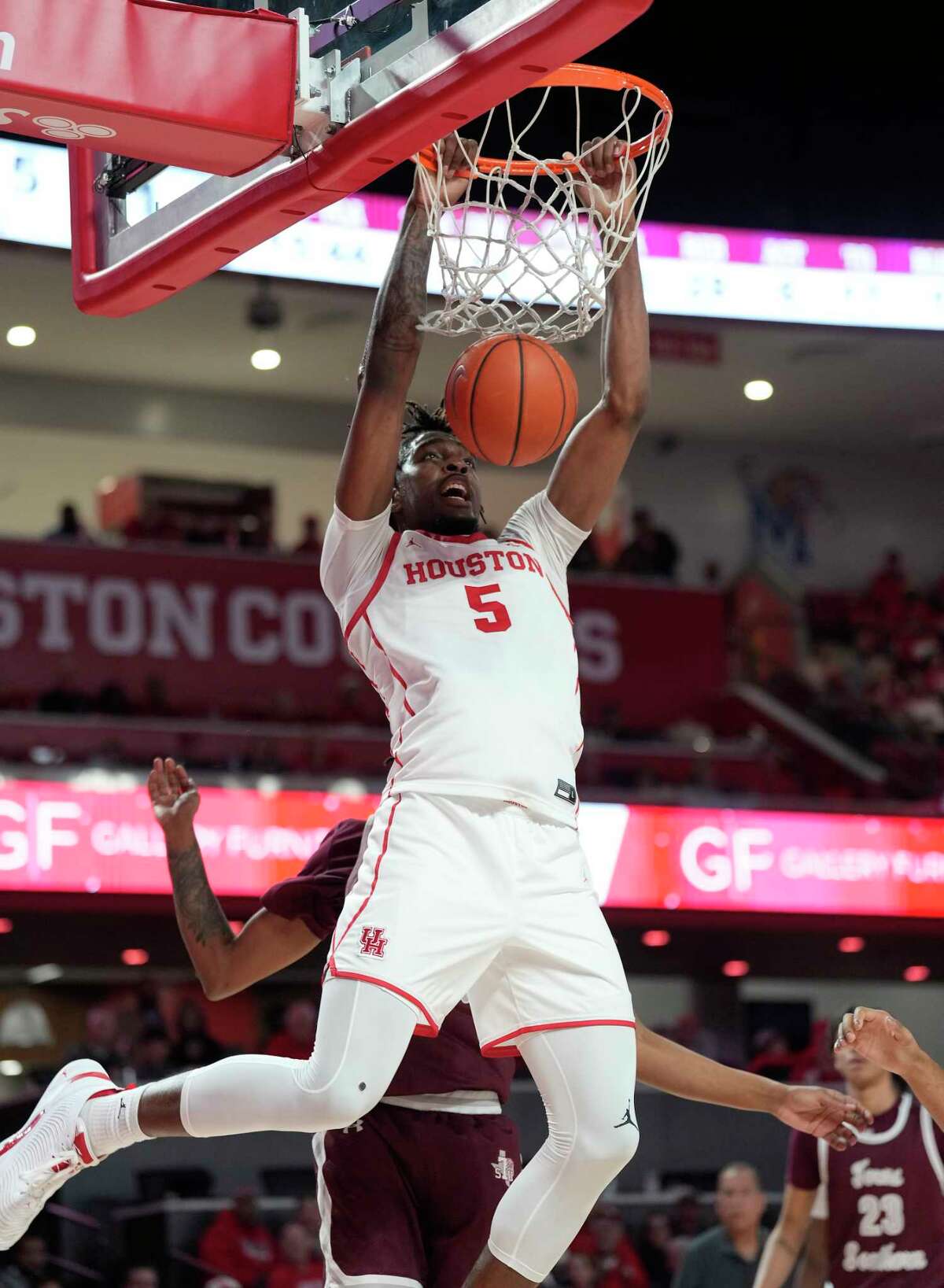 Houston Cougars forward Ja'Vier Francis (5) dunks the ball during the second half of a NCAA men’s basketball game at Fertita Center on Wednesday, Nov. 16, 2022 in Houston.