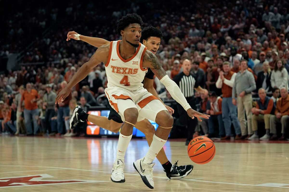 Texas guard Tyrese Hunter (4) drives past Gonzaga guard Rasir Bolton, right, during the second half of an NCAA college basketball game, Wednesday, Nov. 16, 2022, in Austin, Texas. (AP Photo/Eric Gay)