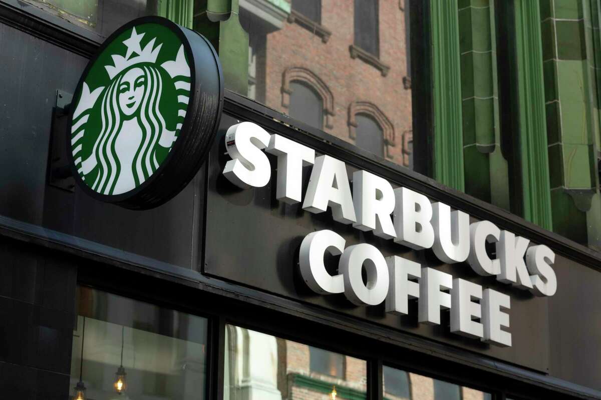 FILE - The Starbucks logo is seen on a storefront, Friday, Oct. 14, 2022, in Boston Starbucks reports quarterly financial results Thursday, Nov. 3, 2022. (AP Photo/Michael Dwyer, File)