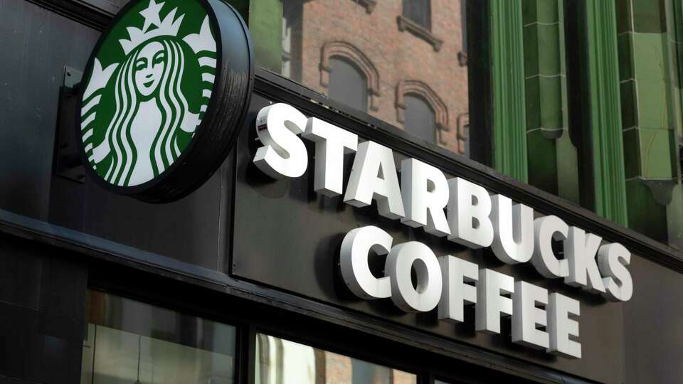 FILE - The Starbucks logo is seen on a storefront, Friday, Oct. 14, 2022, in Boston Starbucks reports quarterly financial results Thursday, Nov. 3, 2022. (AP Photo/Michael Dwyer, File)