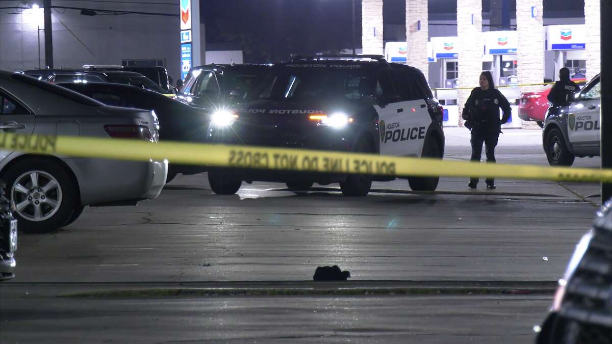 Crime scene tape surrounds a scene in southwest Houston where a 19-year-old man was killed after being shot in the head.
