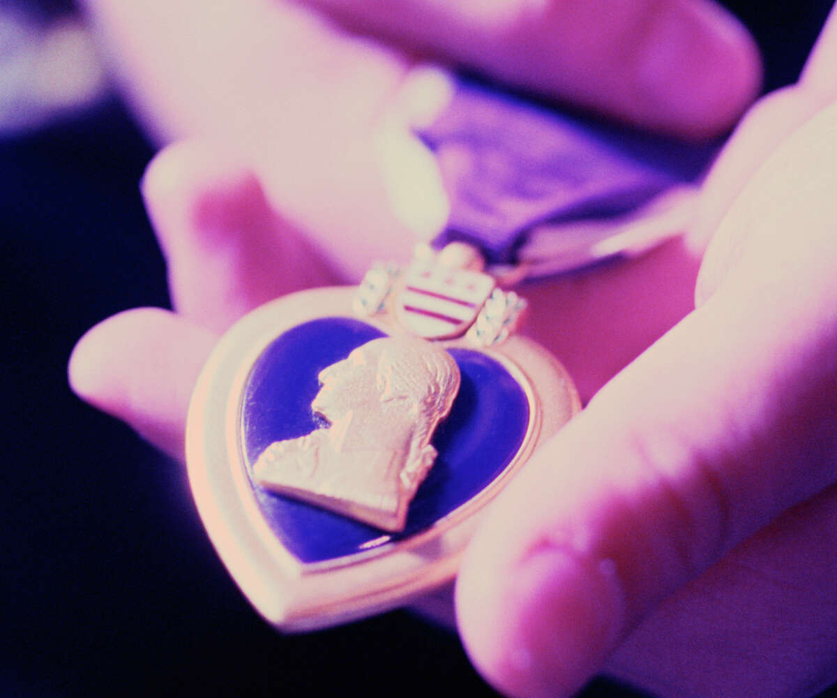 The state is trying to find the owners of 11 Purple Heart medals that are among unclaimed property in its possession.