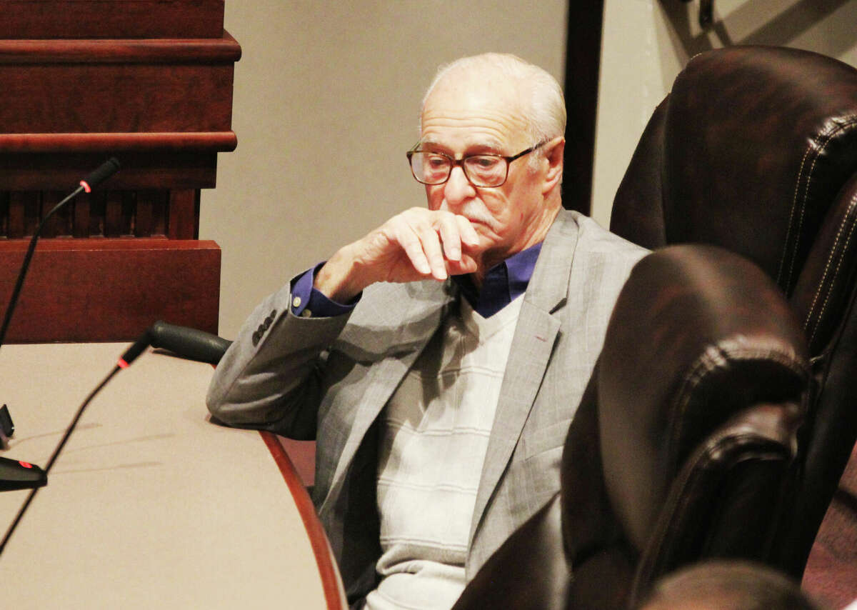Long-time Madison County Board member Jack Minner, D-Edwardsville, waits for the start of a Health Committee Meeting Wednsday. Minner, who has served on the board for 22 years, declined to run again and was one of 11 outgoing members honored at the full County Board meeting that followed the Health Department Committee meeting.